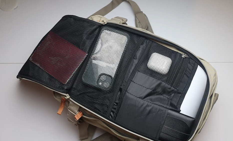 Cabin Max Metz Stowaway 20L Travel Bag filled to 90% capacity, demonstrating maximum packing space, compression straps in use, and sturdy underseat fit during travel testing.