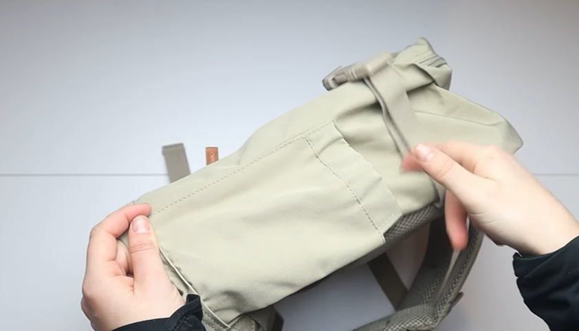 Cabin Max Metz Stowaway 20L Travel Bag displayed on a suitcase-ready surface, showing its lightweight 16x10x8 inch underseat design and compression straps.