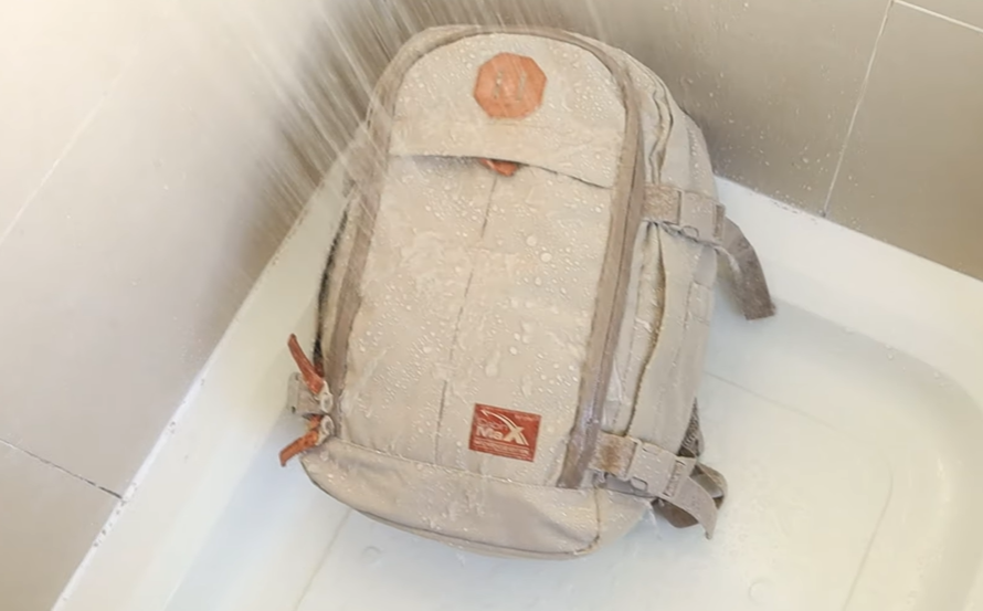 Expert demonstrating packing techniques in the Cabin Max Metz Stowaway 20L Travel Bag, showing space optimization, organization, and efficient underseat travel use.